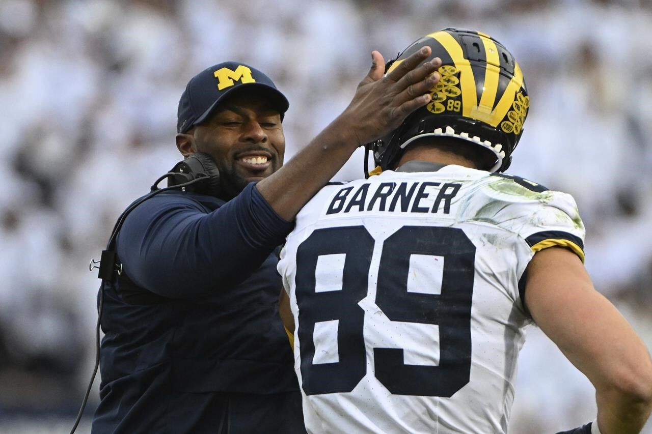 No. 2 Michigan stays unbeaten as coach Harbaugh serves ban in 24