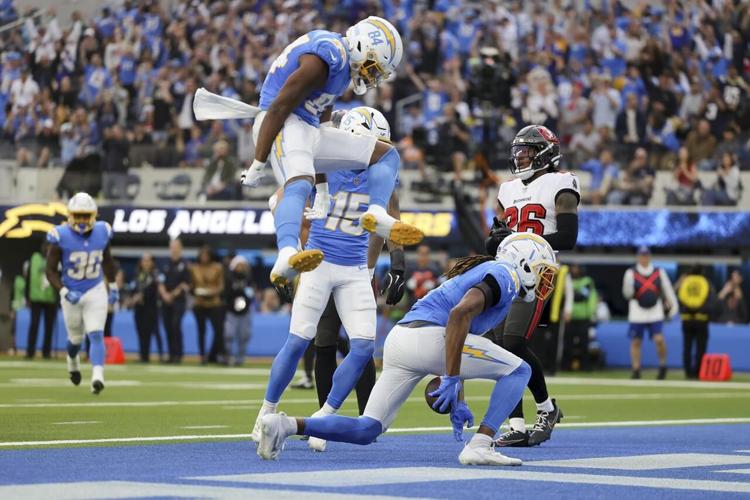 Chargers fall apart in a disastrous second half, capped by Herbert's ...