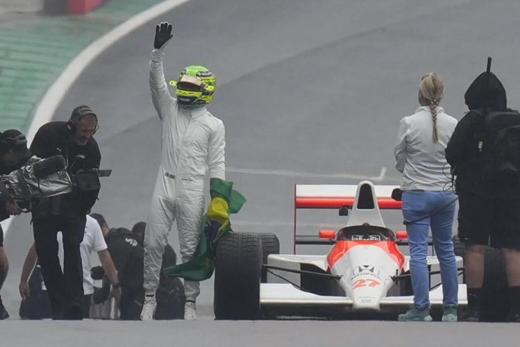 Emotional Hamilton drives Senna's car before Brazilian Grand Prix