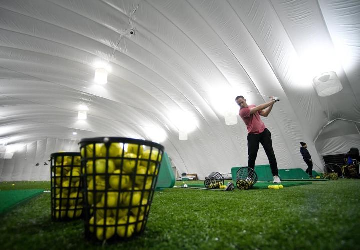 Indoor driving range helps Hamilton golfers stay active over the winter