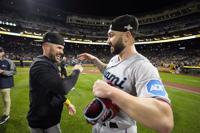 Manager Skip Schumaker of the Miami Marlins walks to the mound for