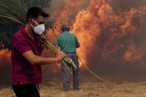 Spain battles one of its most destructive fire seasons even as its heat wave eases