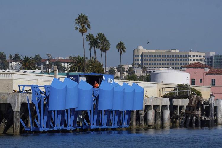 In LA port bobbing blue floats are turning wave power into clean energy