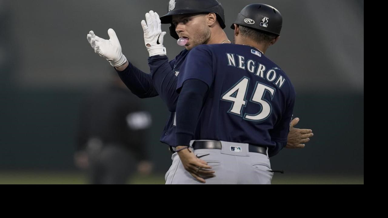 PHOTOS: Seattle Mariners Catcher Cal Raleigh Raises The 12 Flag