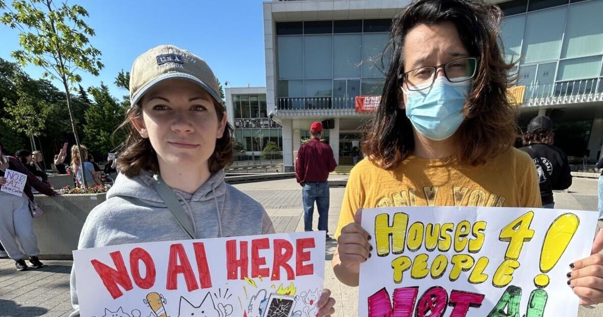 Protesters rally at city hall ahead of vote at planning committee Tuesday.