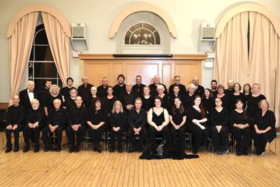 Dundas Concert Band members in all black sitting in rows