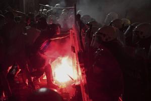 Tear gas fired at thousands of protesters in Serbia demanding free elections and justice