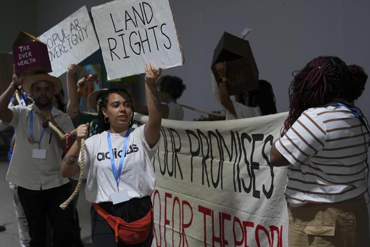 Protesters gather at UN climate talks in global day of action as ...
