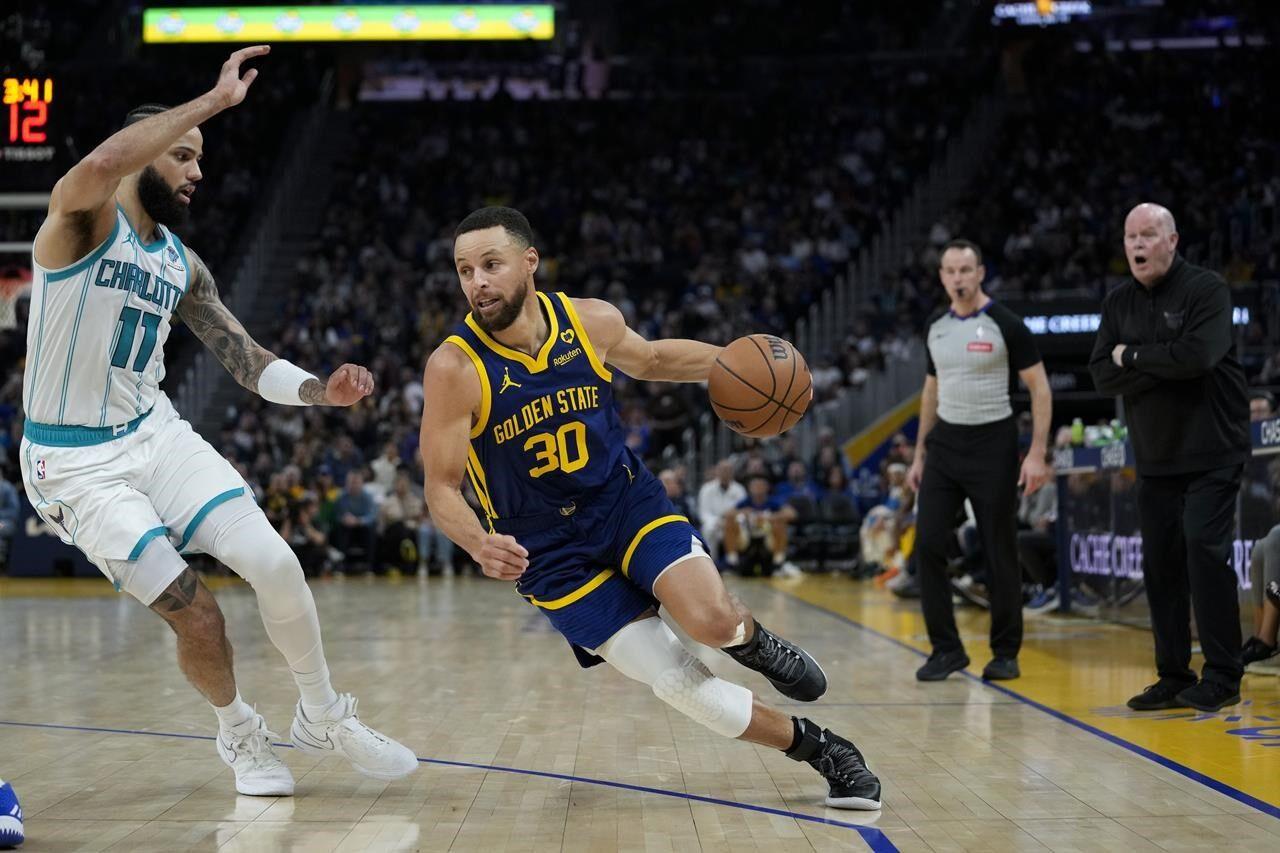 Stephen Curry helps Warriors fend off Nets, 124-120