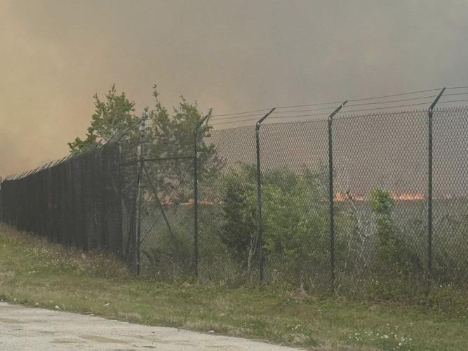 Brush fire, smoky conditions shut down road leading in and out of ...