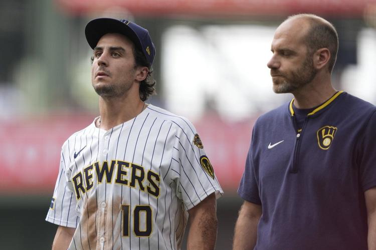 Brewers RF Sal Frelick departs after making a sliding grab