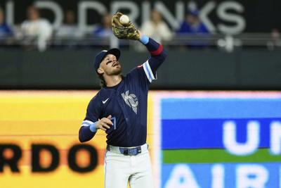 Bobby Witt Jr. leaves game with low back spasms