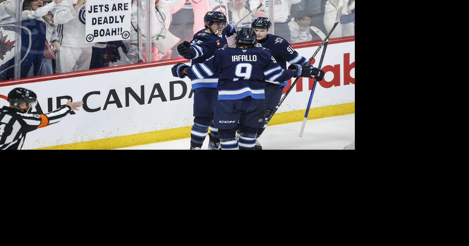 Connor's late goal fuels Jets to 5-3 win over Blues in playoff opener