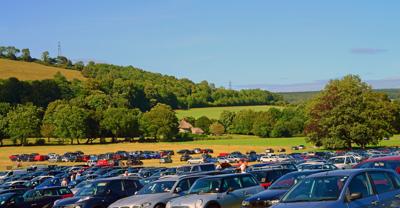 Cars parked in a field