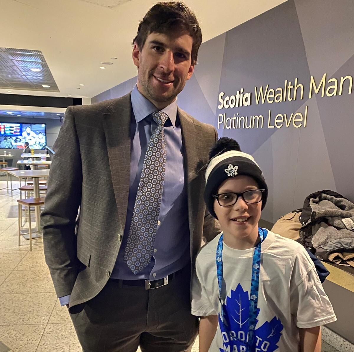 John Tavares of the Toronto Maple Leafs poses with his jersey