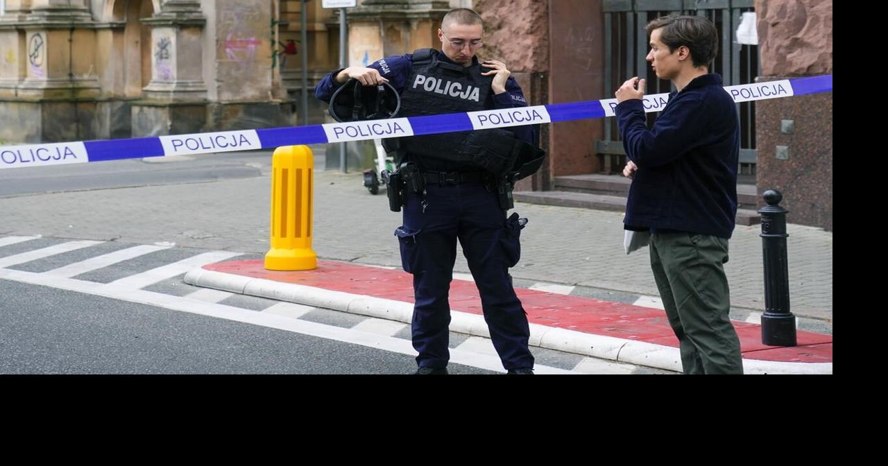 Police in Warsaw detain a man who climbed a monument and reportedly ...