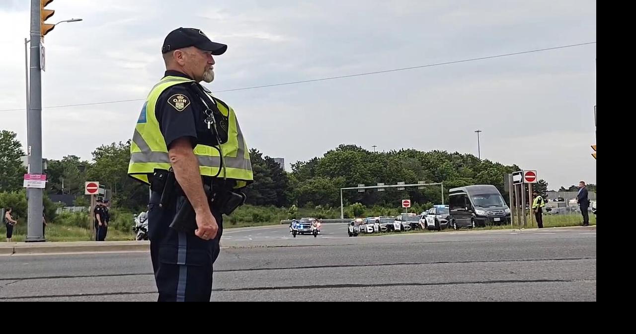 Procession carries body of Marc Pinizotto