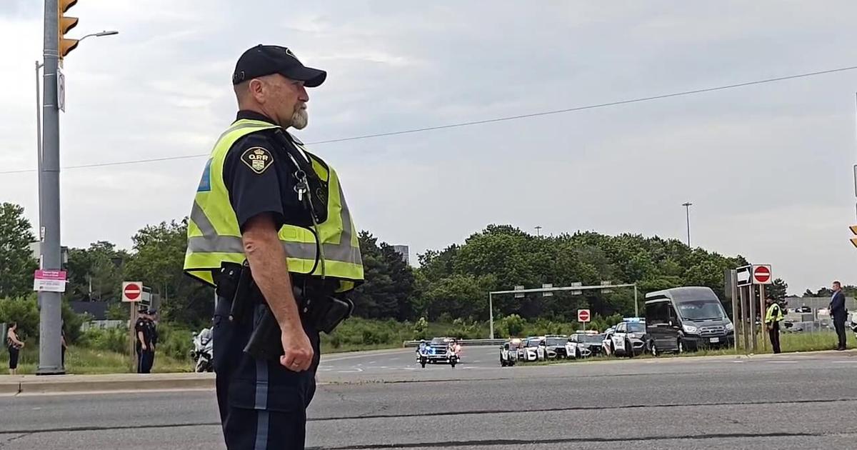 Procession carries body of Marc Pinizotto