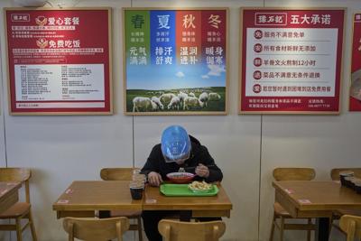 China's army of food delivery drivers get by with help from discount 'loving meals'