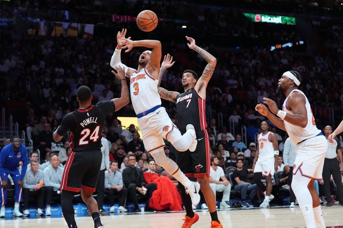 Powell scores 29 as Heat beat Knicks 115-107 in Miami's home opener