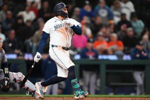 Mariners rally past Astros 6-5 in 10 innings to keep faint playoff hopes alive