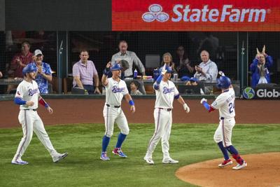 Helman's grand slam and Latz's scoreless outing push playoff-chasing Rangers past Brewers