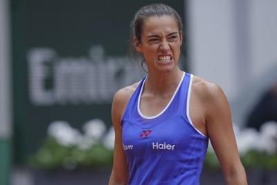 A teary-eyed Caroline Garcia plays her final French Open match