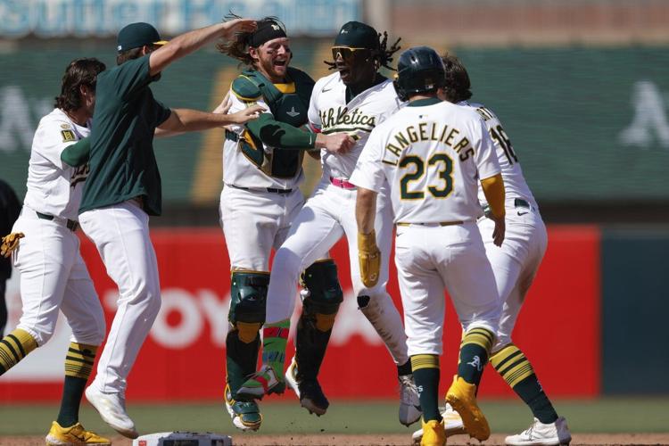 Kurtz, Butler power A's past Red Sox 5-4, end Chapman's hitless streak of 50 batters, 17 appearances