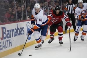 Lazar scores winner with 23 seconds left as the Devils rally past the Islanders 5-4
