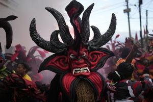 AP PHOTOS: Panama town reckons with dark history of colonialism in Festival of Devils and Congos