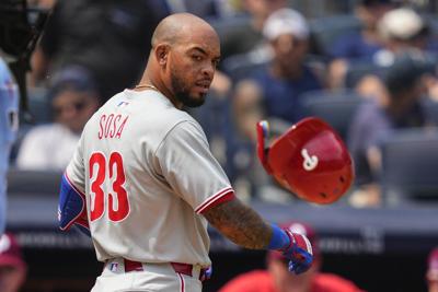 Phillies third baseman Edmundo Sosa leaves after collision with left fielder Brandon Marsh