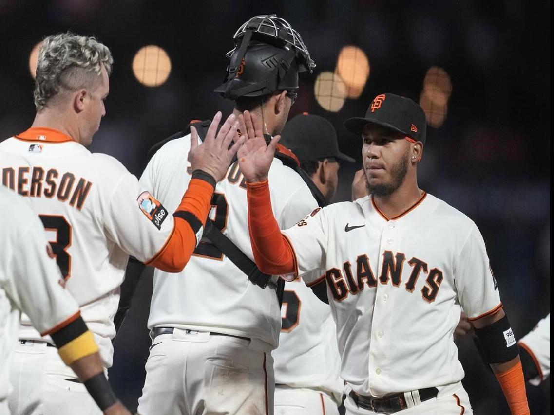 Mitch Haniger of the San Francisco Giants rounds the bases after