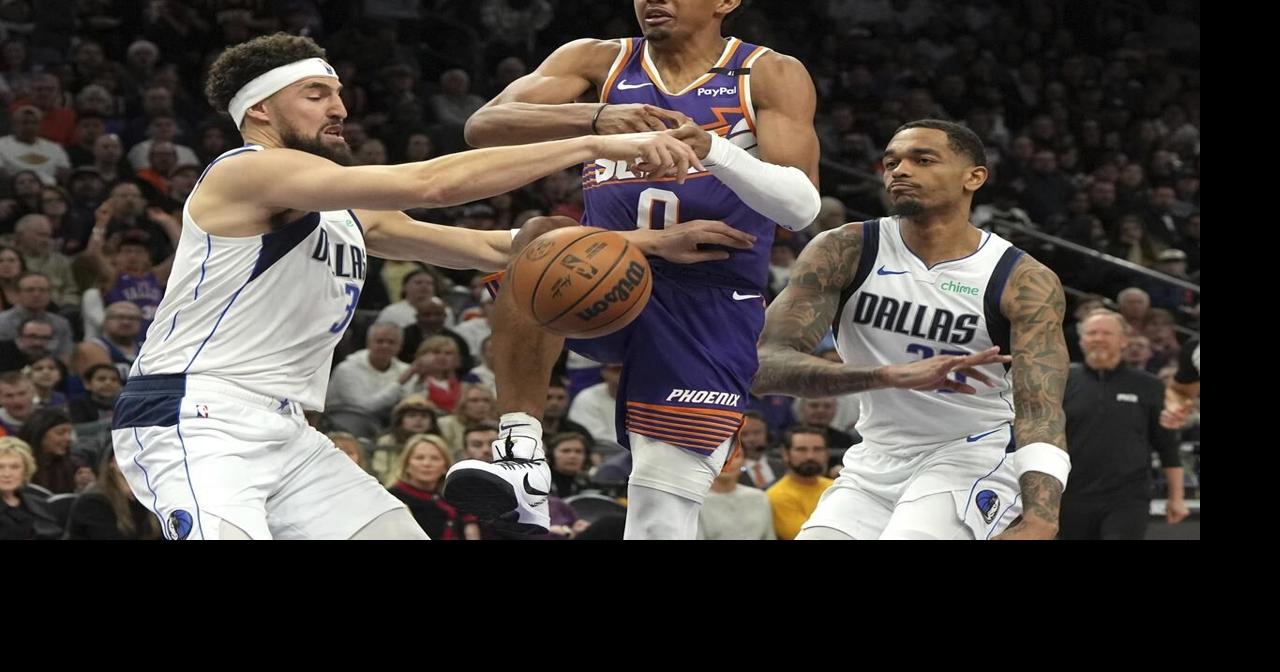 Kyrie Irving scores 20, Mavs win first game after Doncic's injury by beating the Suns 98-89