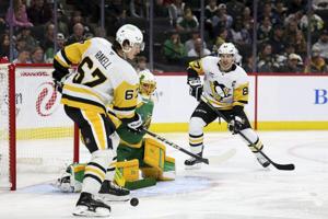Crosby scores a pair of goals and Jarry stops 30 shots as Penguins top Wild 3-1 to end 4-game skid
