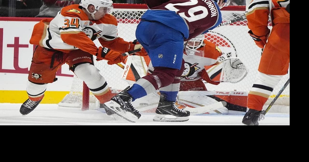 MacKinnon scores in OT to lift Avalanche past Ducks 4-3 for 1st win