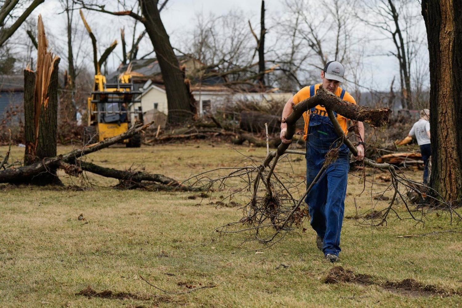 Community Damage Photos show damage left by powerful storms as volunteers help ...