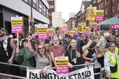 Rival anti-migrant and anti-racism protests face off outside a hotel housing migrants in London