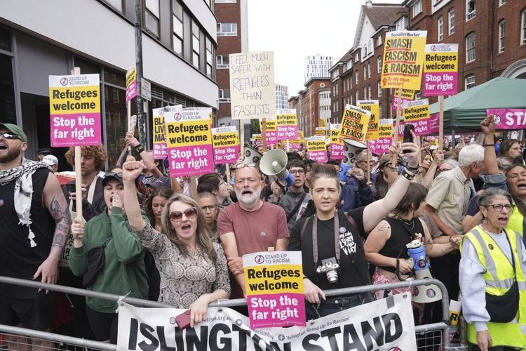 Rival anti-migrant and anti-racism protests face off outside a hotel housing migrants in London