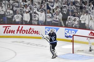 Hellebuyck gets run support, posts shutout in must-win Game 5 for Jets