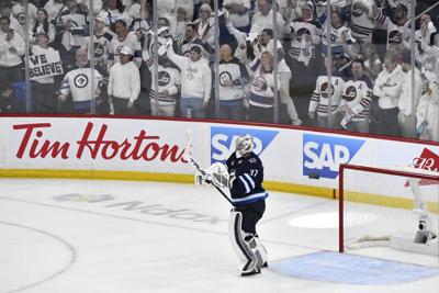 Hellebuyck gets run support, posts shutout in must-win Game 5 for Jets