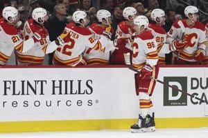 Kuzmenko scores twice as Flames hold off Wild for 5-4 win