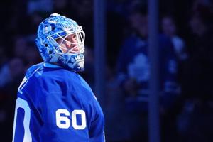 Woll stands tall as short-handed Maple Leafs dump Devils 4-0