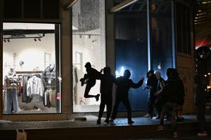 Macron rejects interior minister’s resignation as rioting and looting expose policing failures