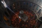 An AP reporter spends the night locked inside Jerusalem's holiest church with clergy and pilgrims