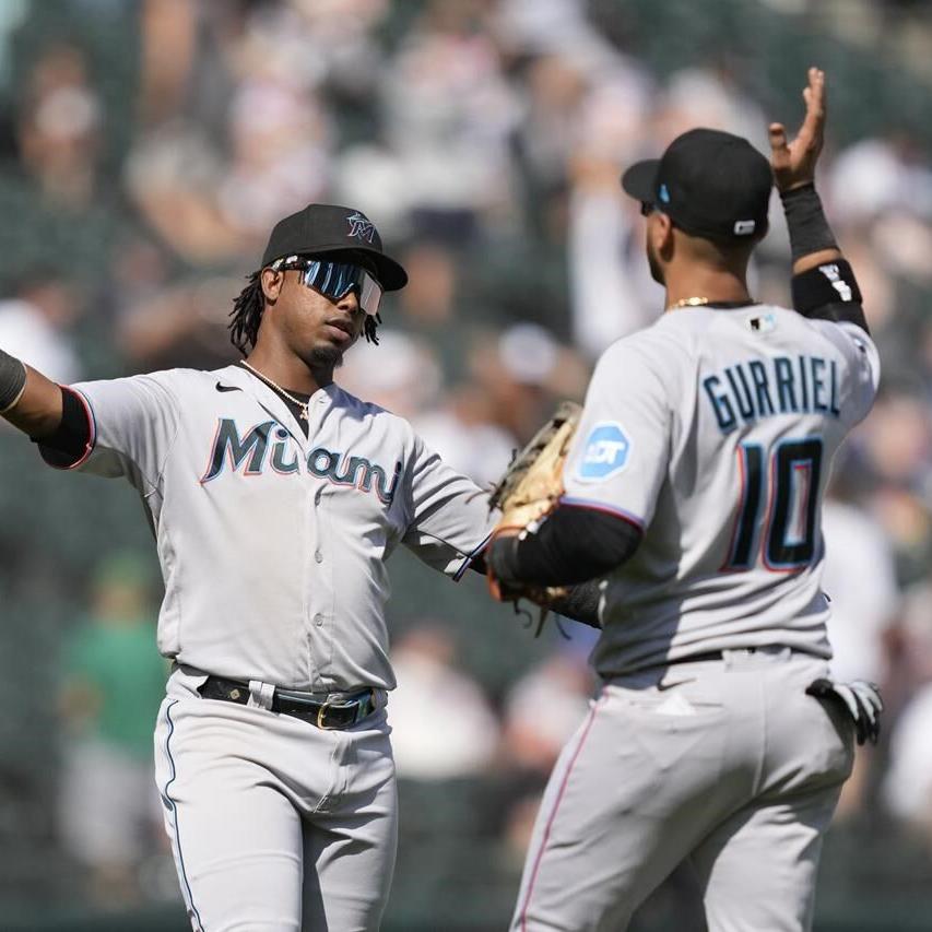 Miami Marlins first baseman Yuli Gurriel (10) swings at the pitch