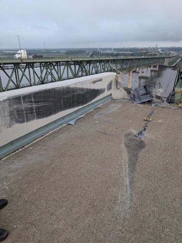 Truck smashes through barrier and plunges off a bridge into the Delaware River