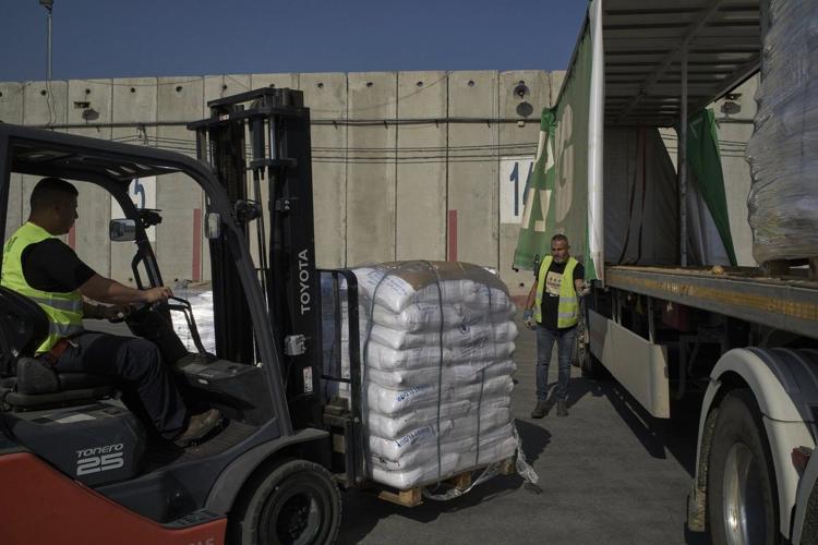 Israel may change tack to allow aid groups in Gaza to stay in charge of non-food aid