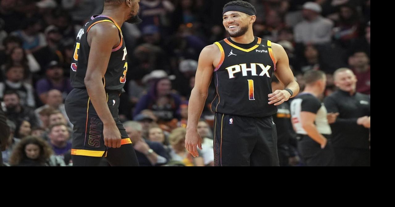 Booker scores 29 and Suns lose Durant to ankle injury in 104-93 win over Spurs