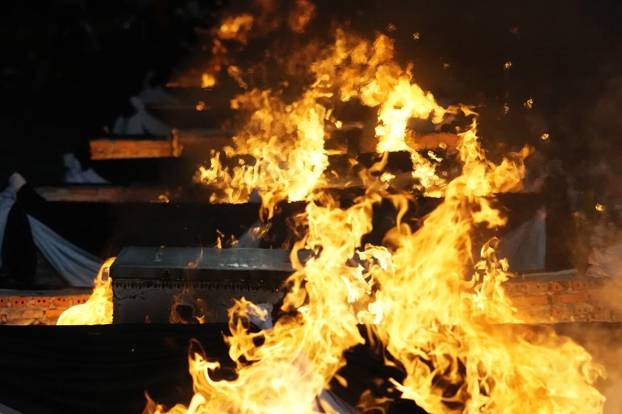 Families Bid Farewell As Thai Massacre Victims Are Cremated