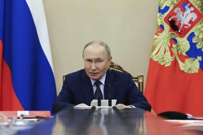 Putin says Russia will stick to nuclear arms limits for 1 more year